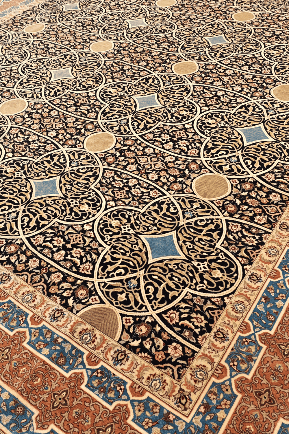 Circle lattice detail in espresso and peach on Pakistani rug