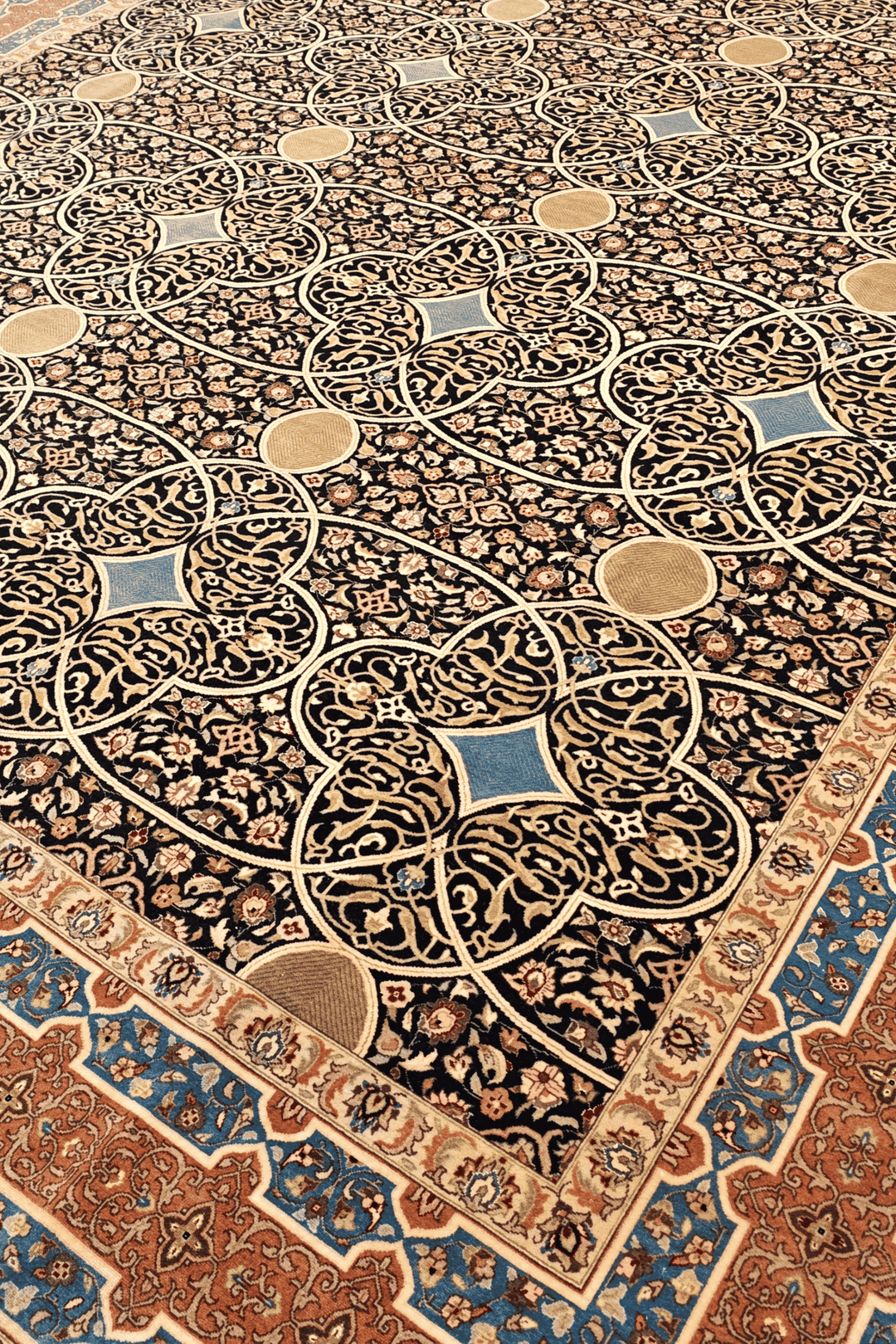 Circle lattice detail in espresso and peach on Pakistani rug