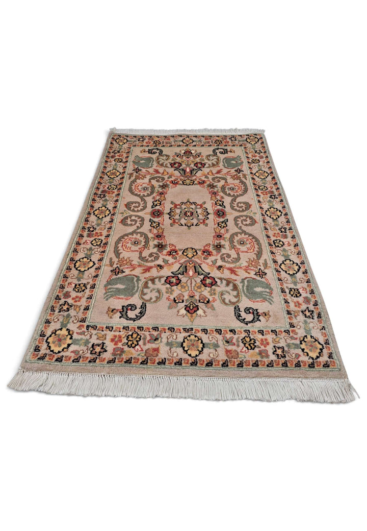 Border detail of blush sage hand-knotted Pakistani rug