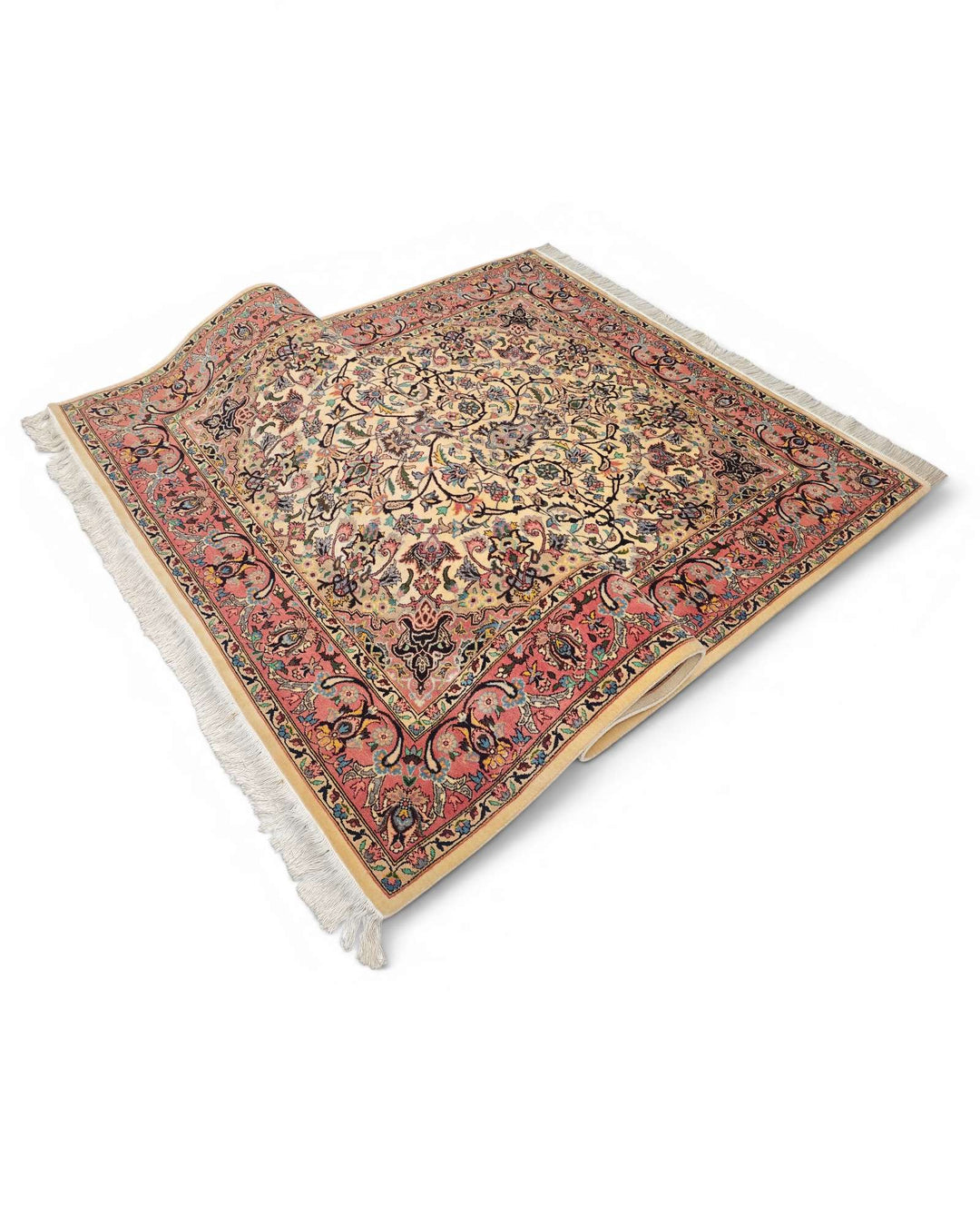 Corner of rose ivory Tabriz Pakistani double-knot rug