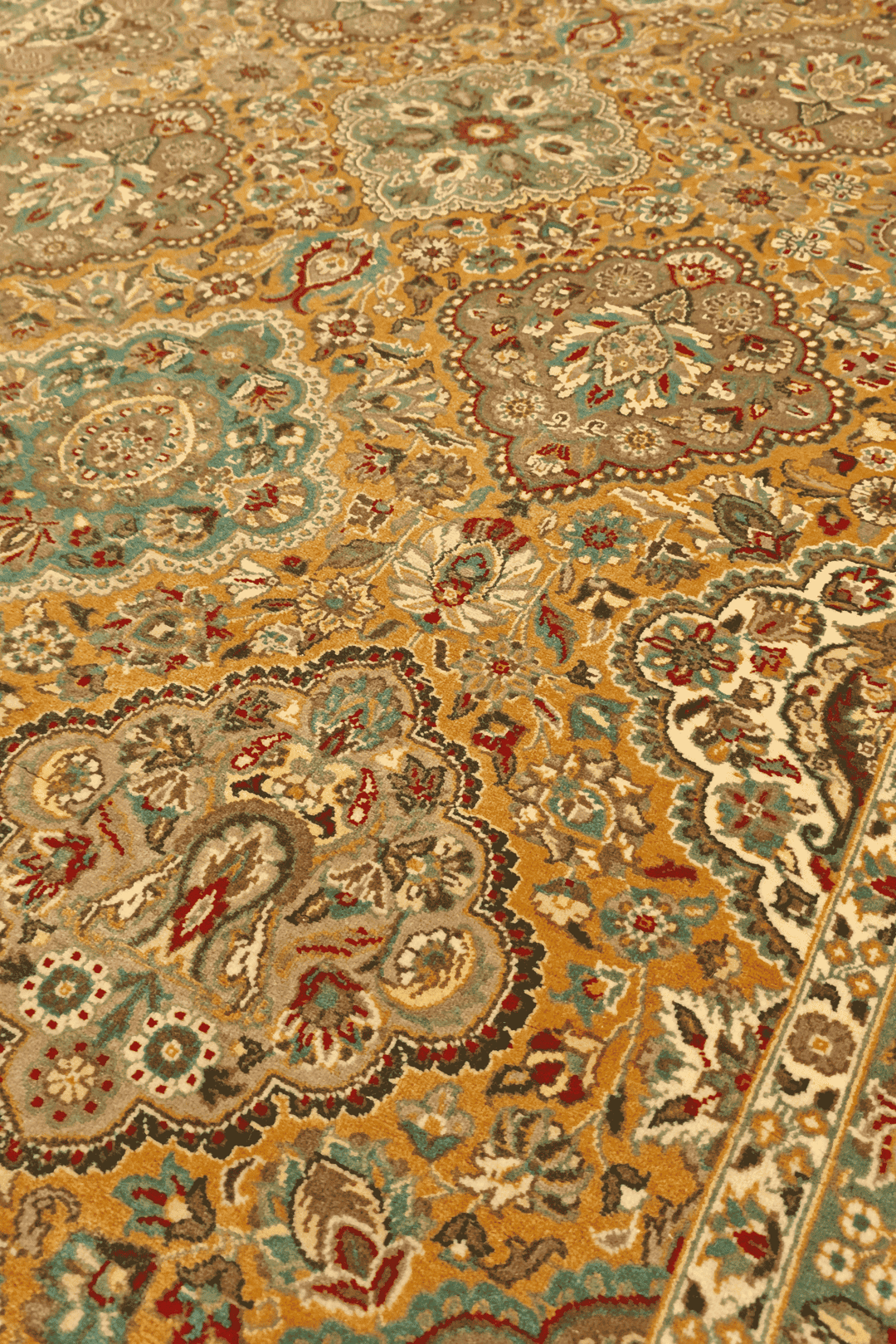 Garden panel detail in honey and sage on Pakistani rug