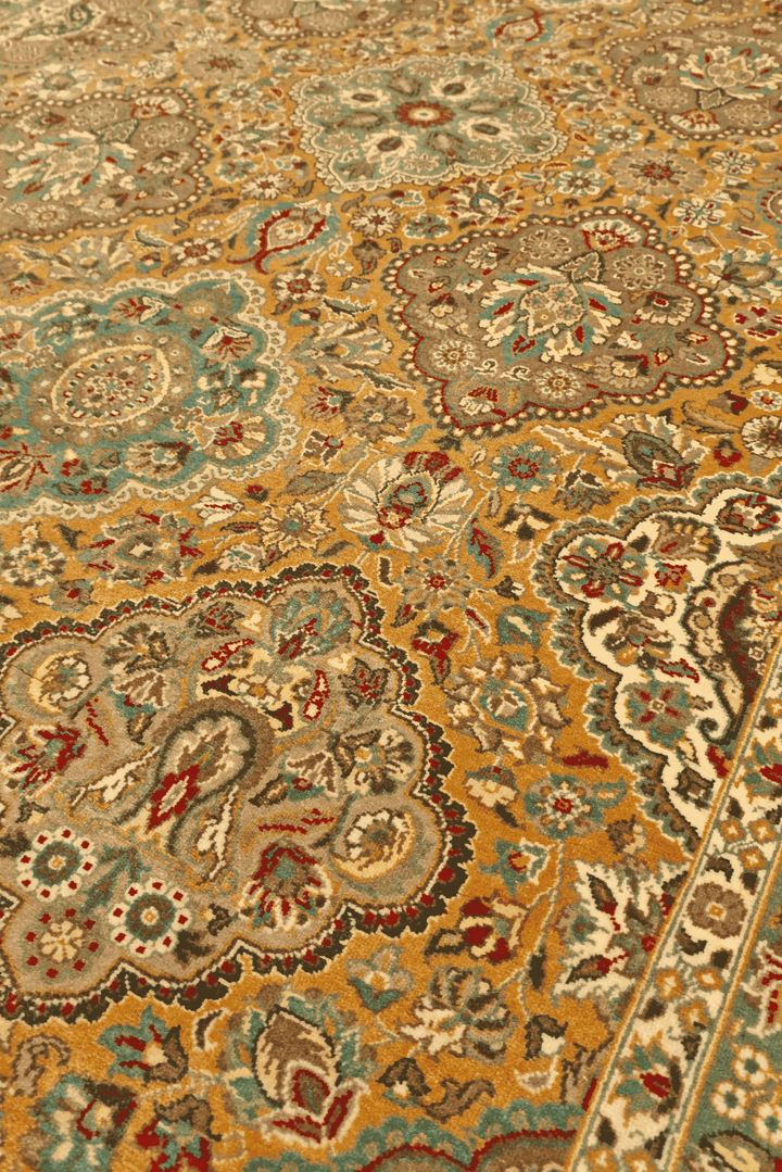 Garden panel detail in honey and sage on Pakistani rug