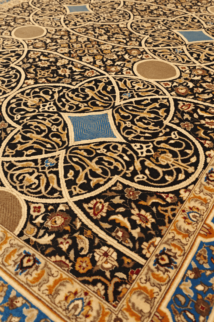Arabesque lattice detail in deep blue on Pakistani rug