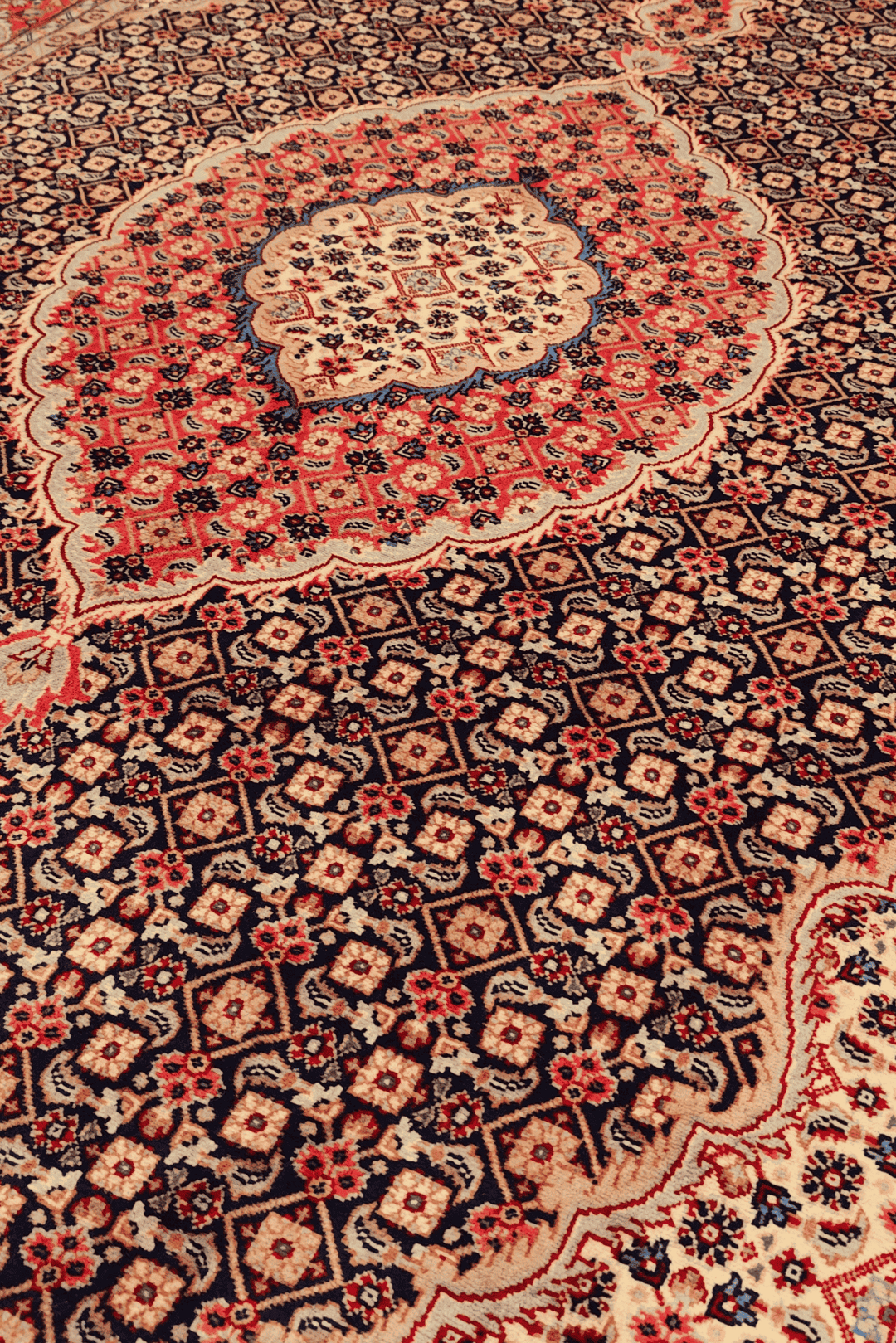 Mahi Herati medallion detail in navy on Pakistani rug