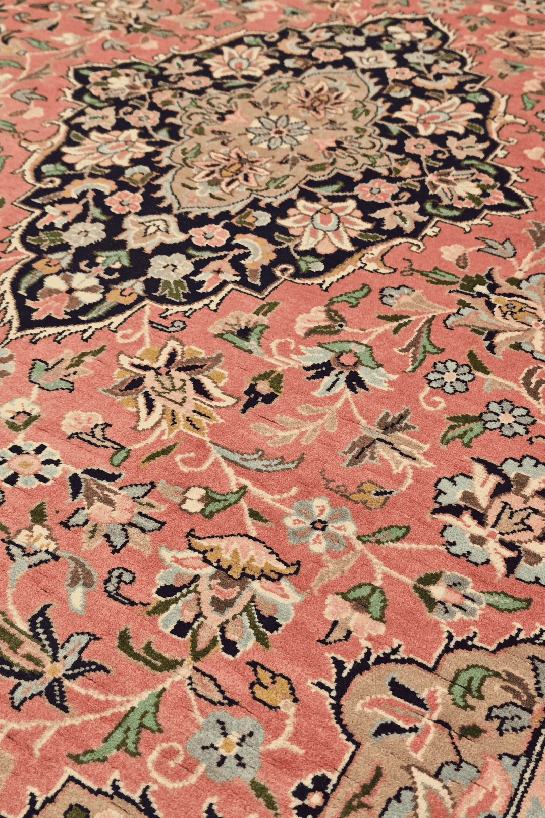 Hand-knotted rose rug with central Tabriz medallion