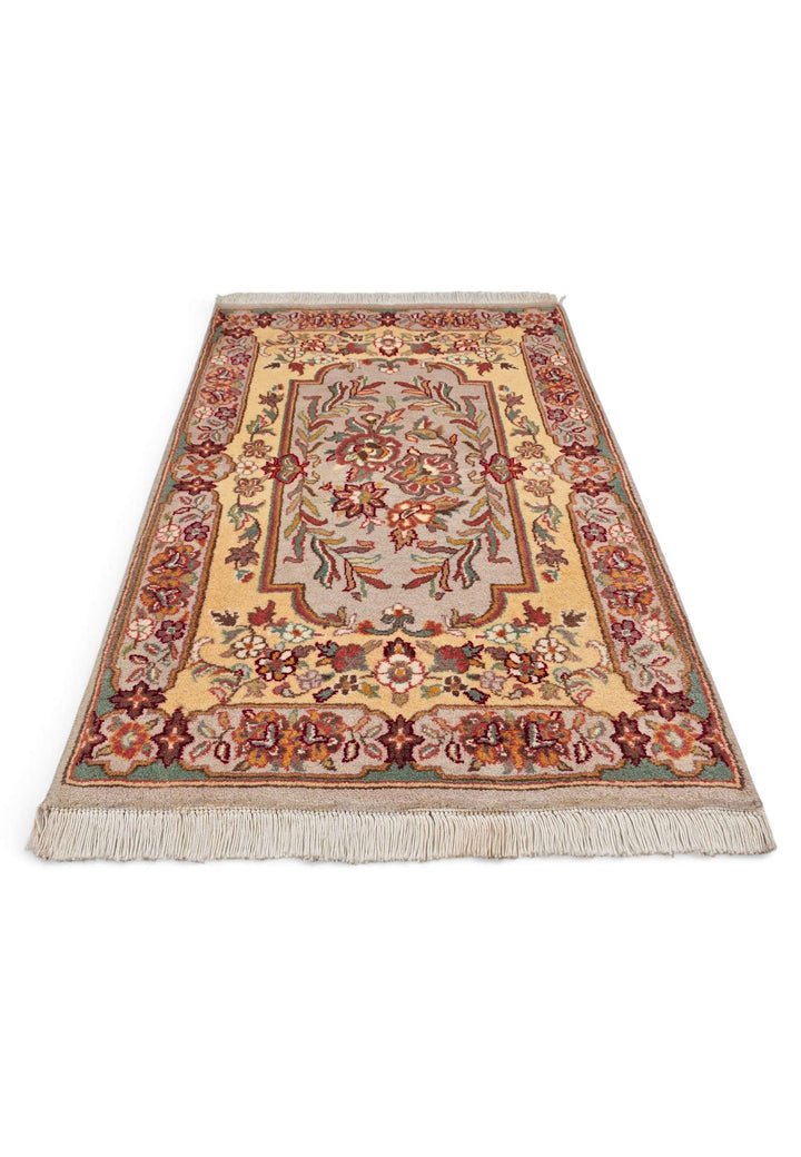 Border detail of butter gold hand-knotted Aubusson style rug