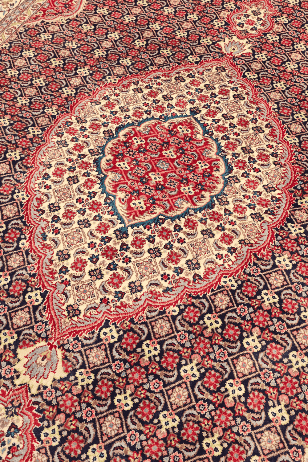 Mahi medallion detail in rose brown on Tabriz rug
