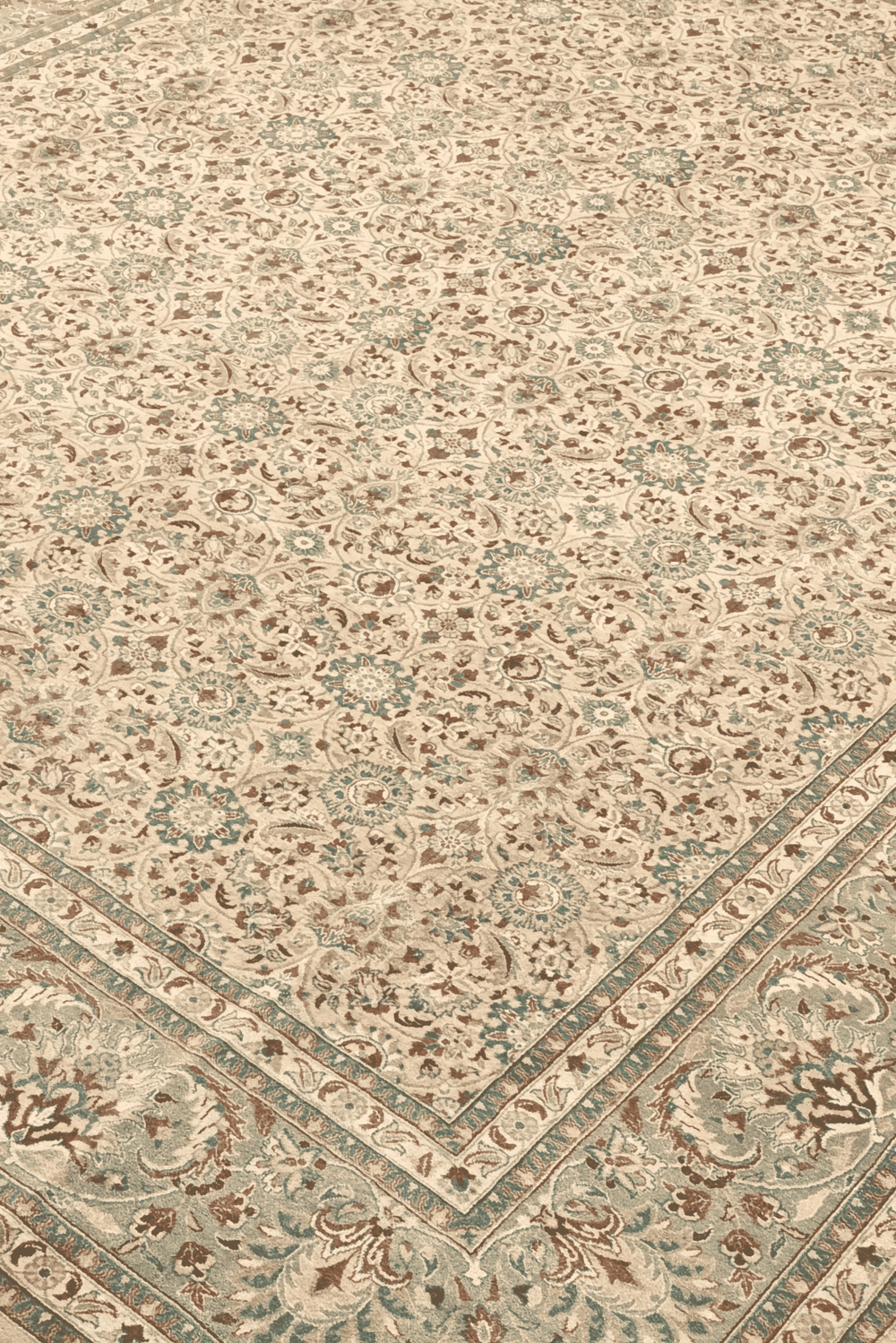 Hereke floral detail in wheat and sage on Pakistani rug