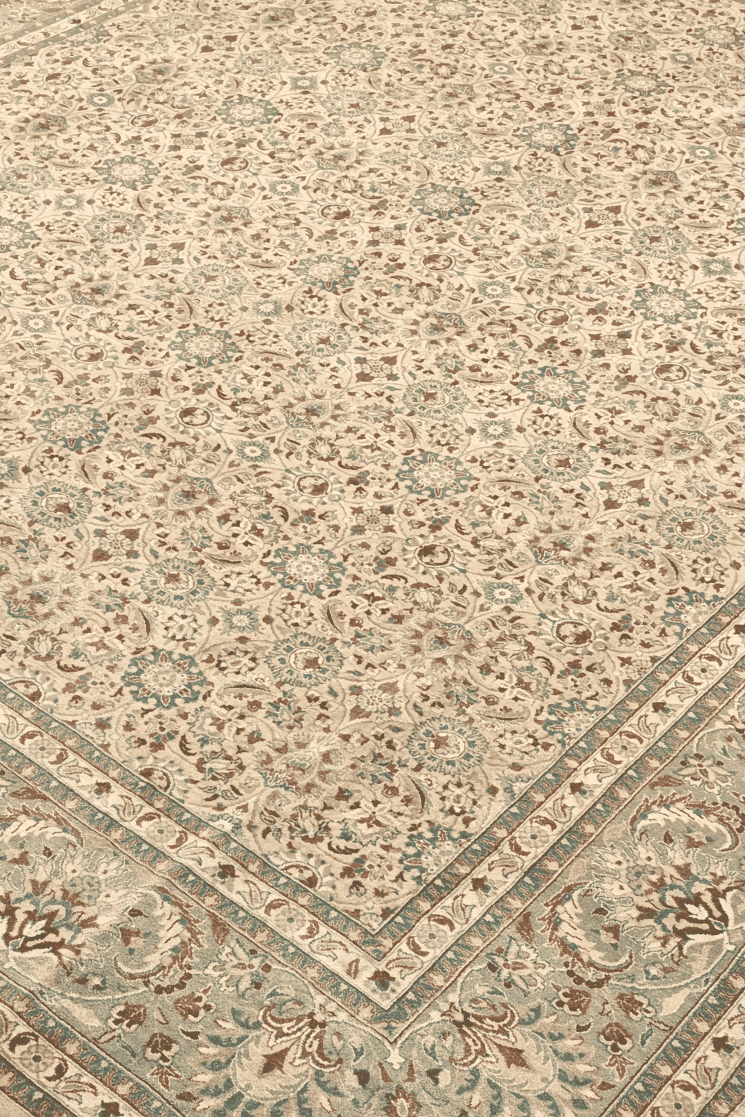 Hereke floral detail in wheat and sage on Pakistani rug
