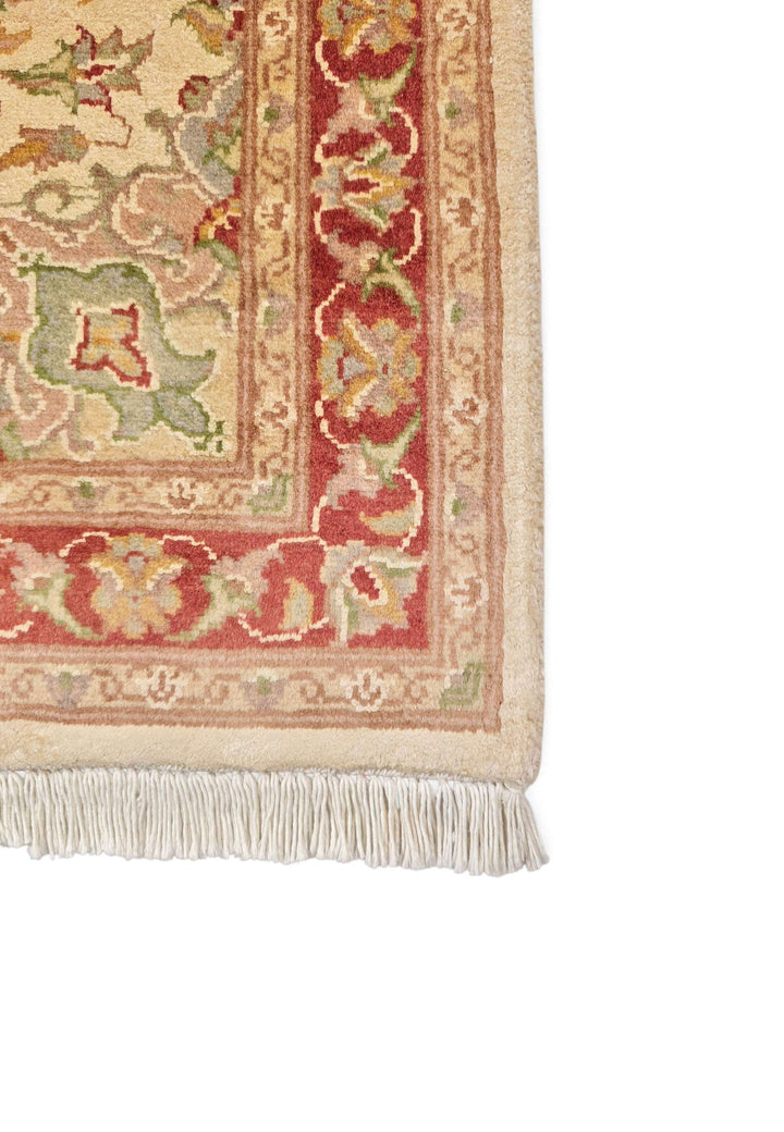 Hand-knotted cream Tabriz rug with silk brick red medallion