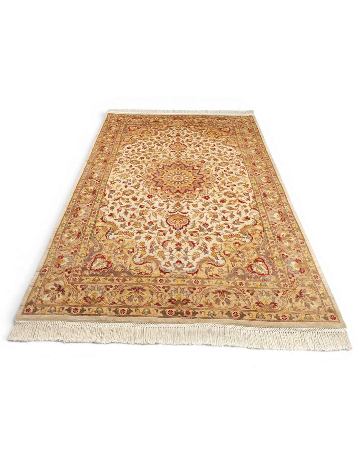 Hand-knotted silk pile of ivory Tabriz rug with natural lustre