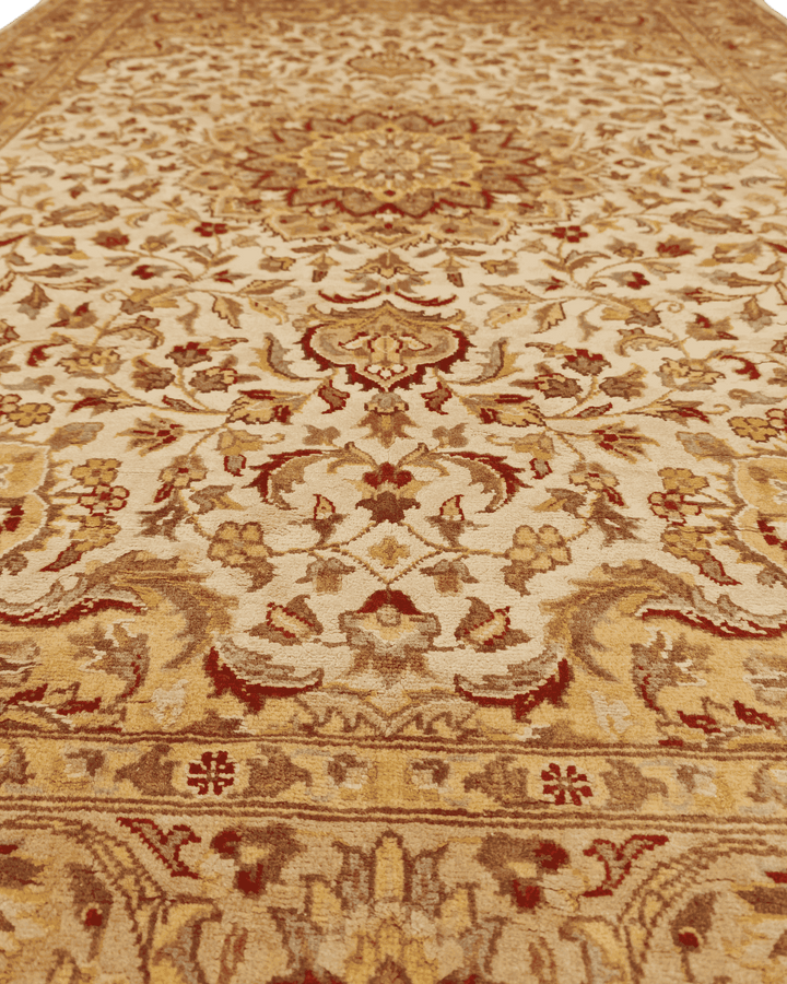 Fringe of ivory silk Tabriz hand-knotted rug