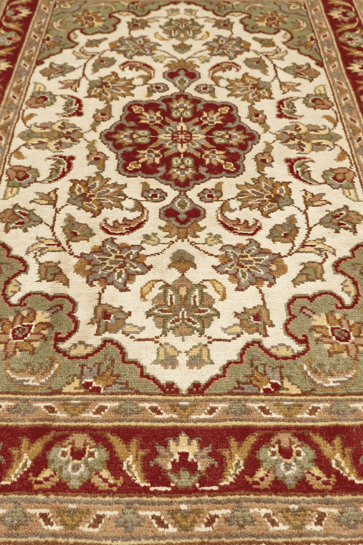 Hand-knotted ivory Tabriz rug with silk deep red medallion