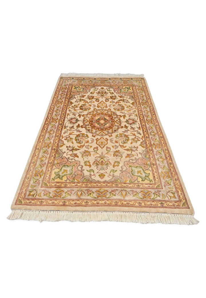 Border detail of ivory coral Tabriz hand-knotted rug