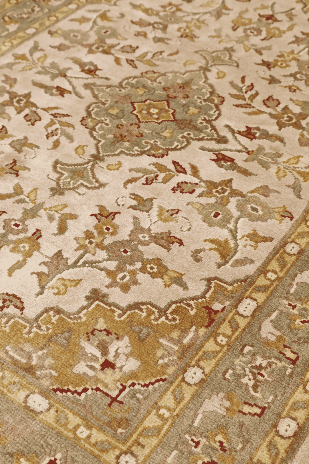 Medallion detail in blush and ochre on Tabriz wool and silk rug