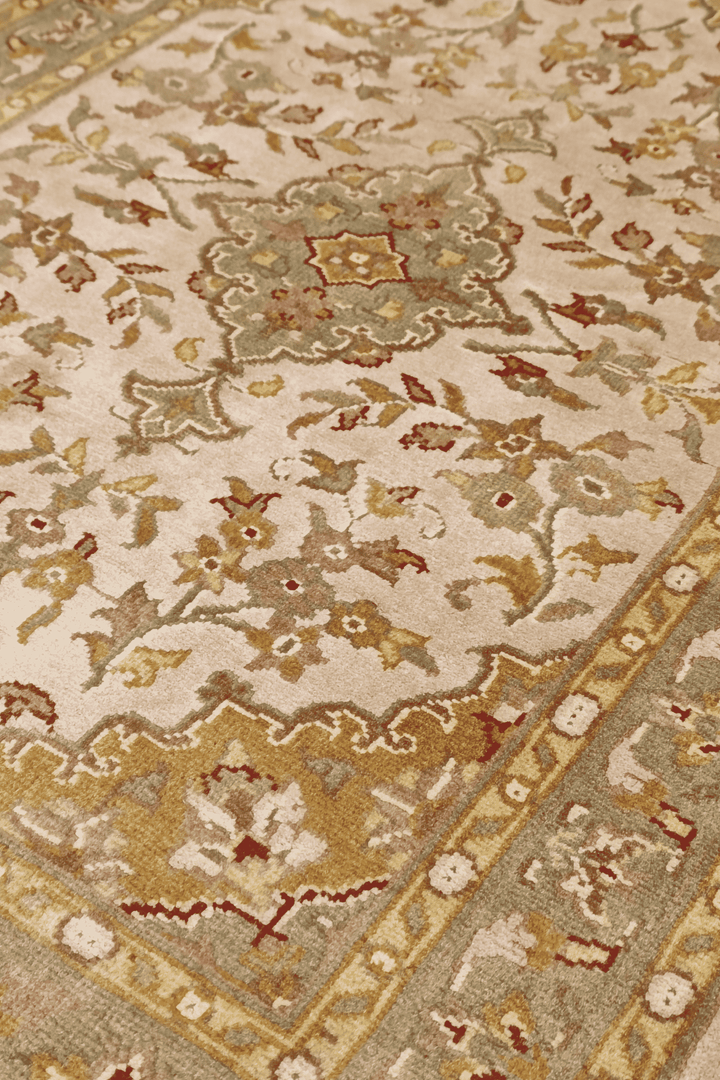 Medallion detail in blush and ochre on Tabriz wool and silk rug