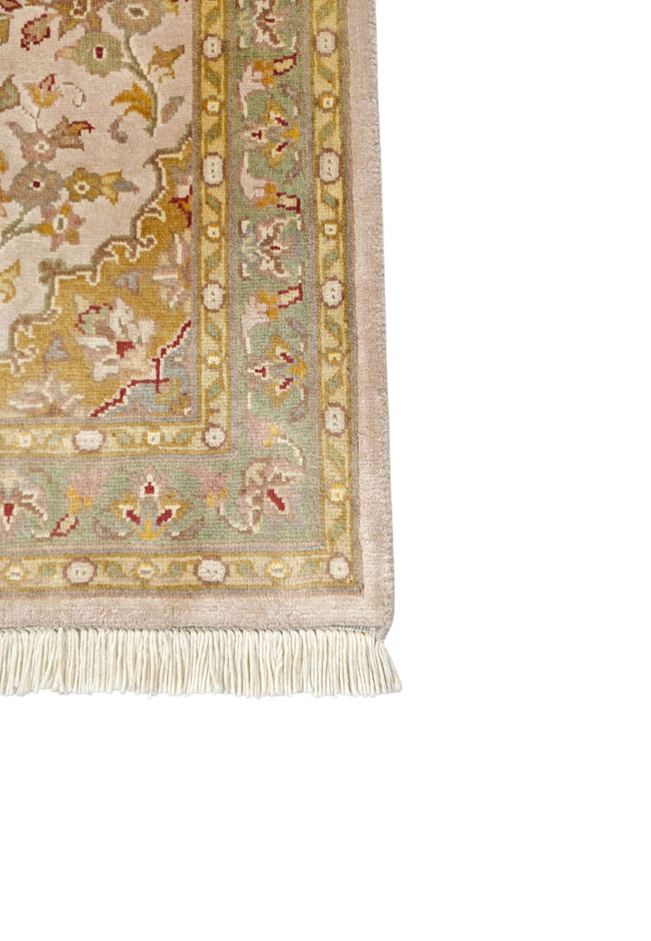 Hand-knotted blush Tabriz rug with silk ochre medallion