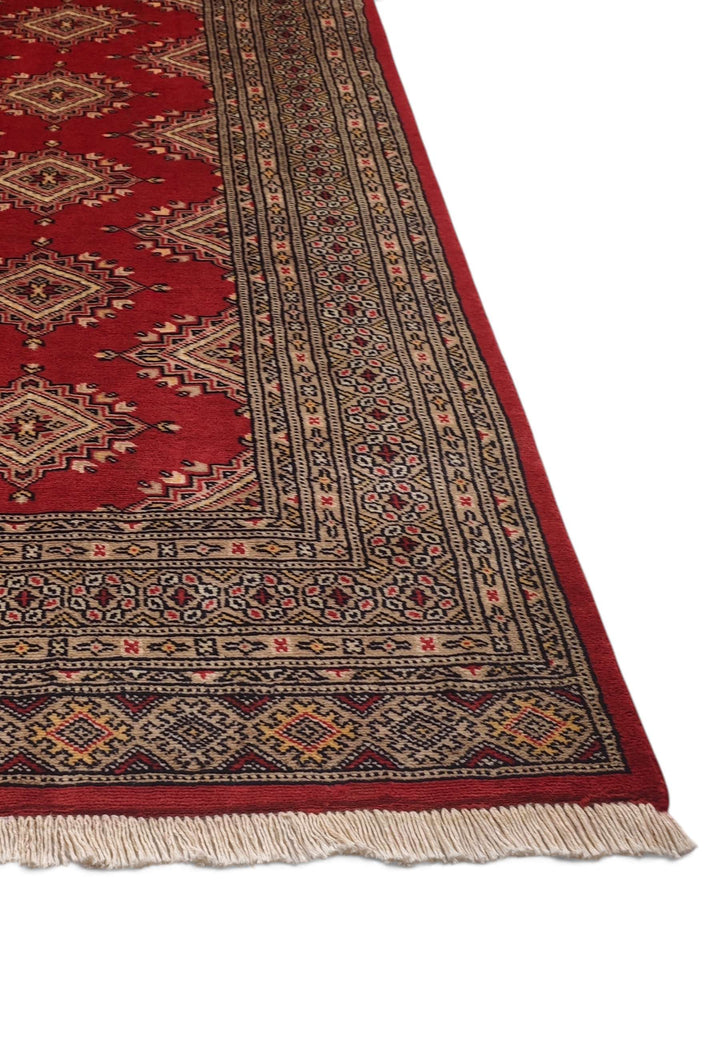 Hand-knotted brick red Jaldar rug with camel star güls