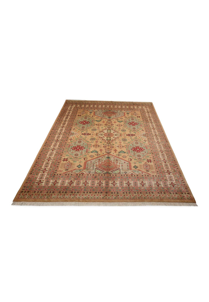 Border detail of camel coral hand-knotted Pakistani rug