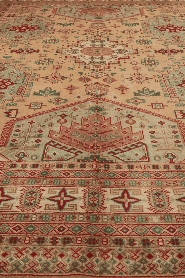 One-of-a-kind camel and coral Caucasian Pakistani rug