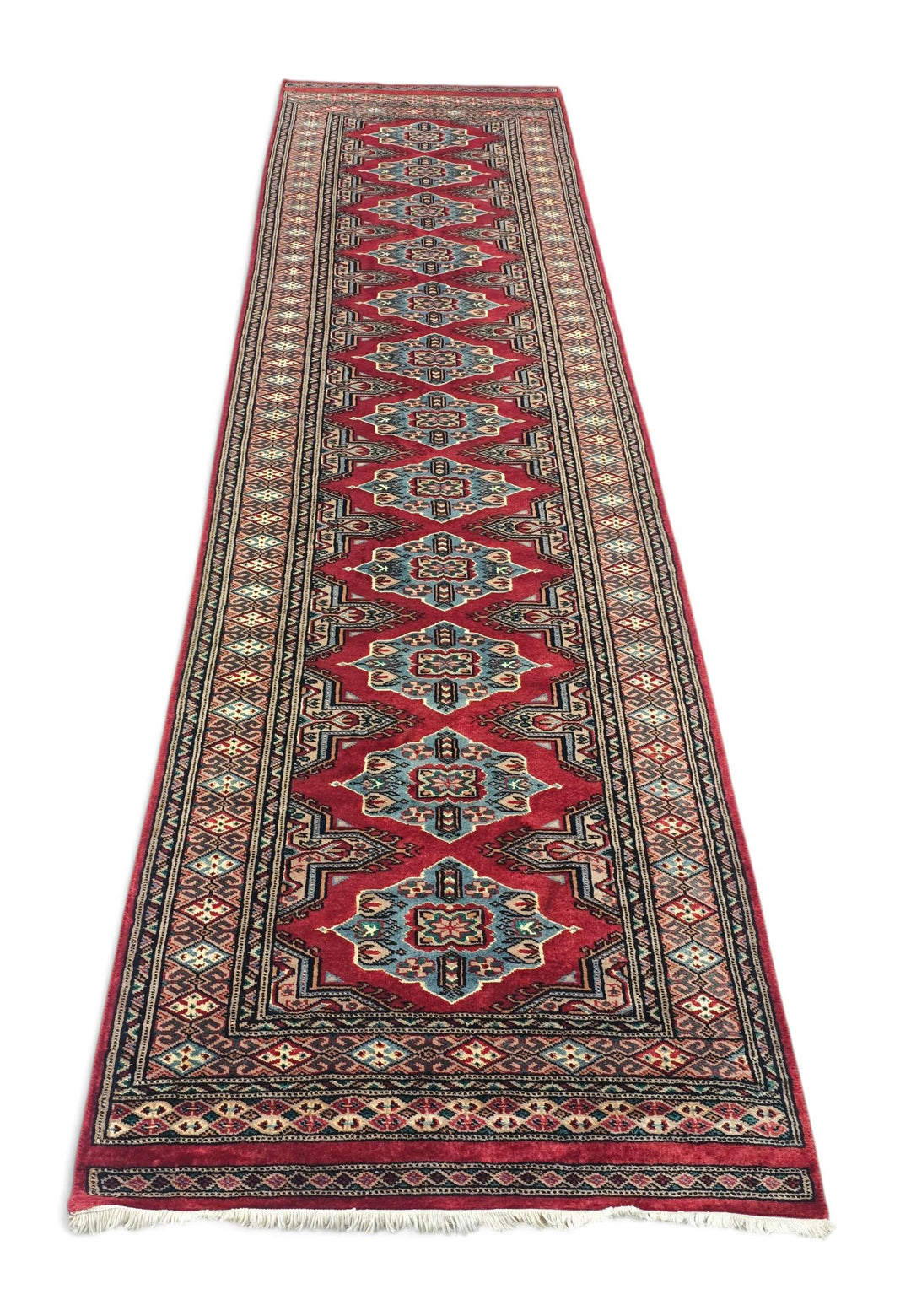 Border detail of crimson Jaldar hand-knotted Pakistani runner