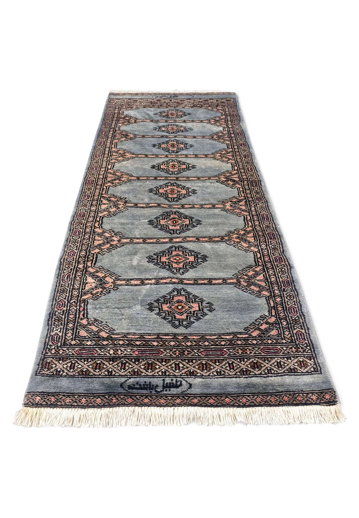 Border detail of dusty blue Jaldar hand-knotted Pakistani rug