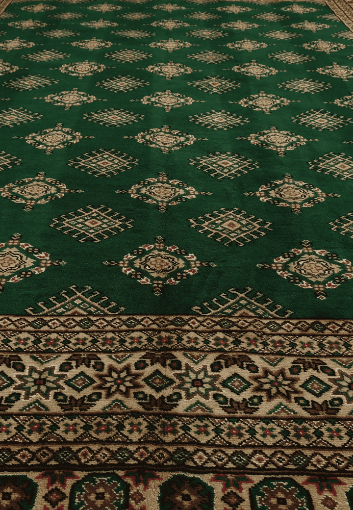 Border detail of pine green Jaldar hand-knotted Pakistani rug