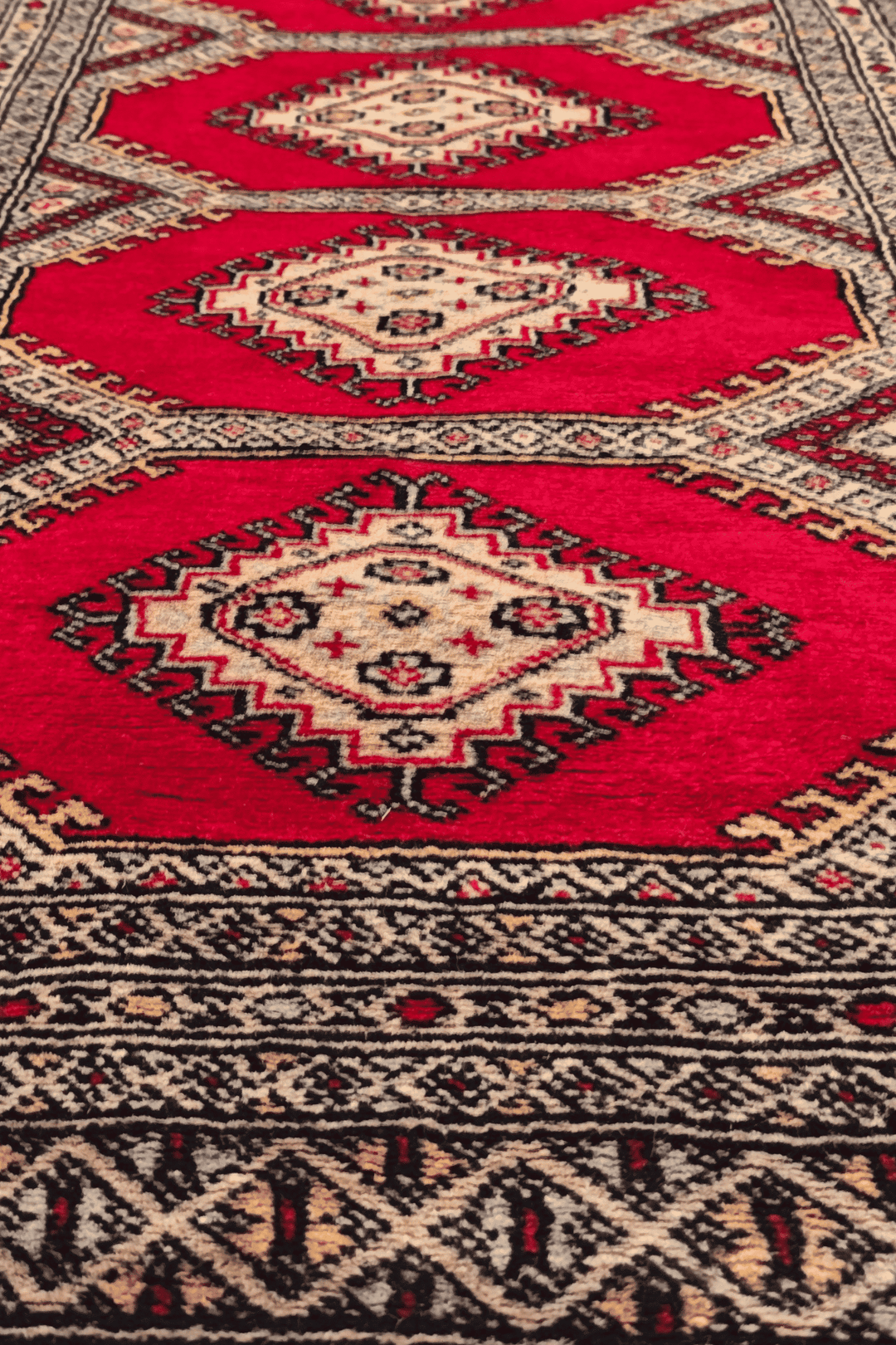 One-of-a-kind ruby red Pakistani Jaldar entrance mat