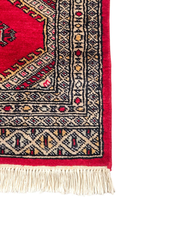 Hand-knotted ruby red Jaldar rug with diamond gül field