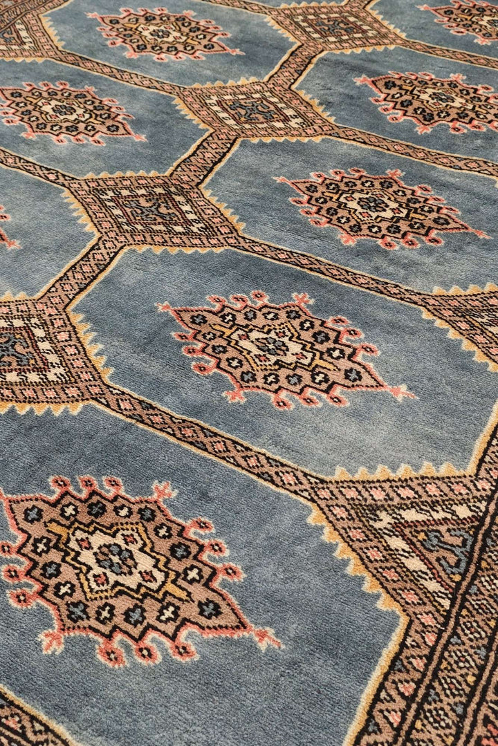 Border detail of slate blue Jaldar hand-knotted Pakistani rug