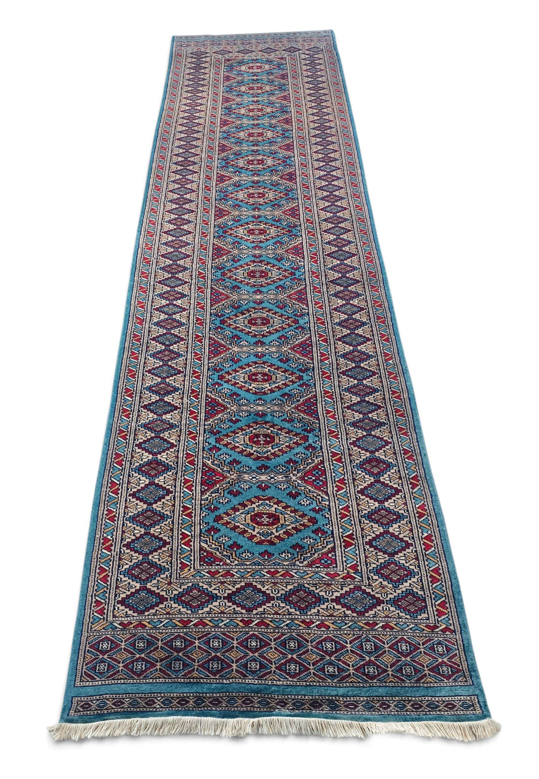 Border detail of turquoise hand-knotted Pakistani runner