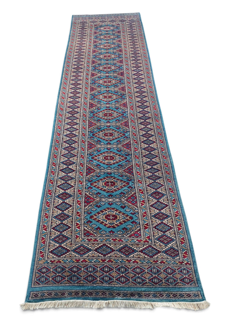 Border detail of turquoise hand-knotted Pakistani runner