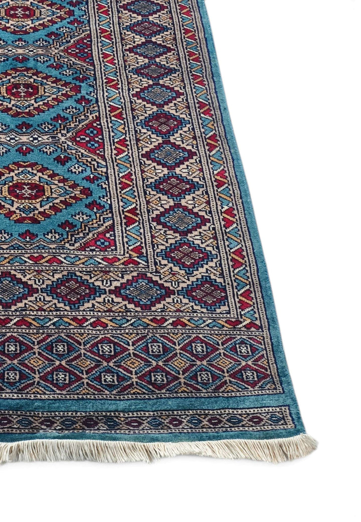 Hand-knotted turquoise runner with chained diamond medallions