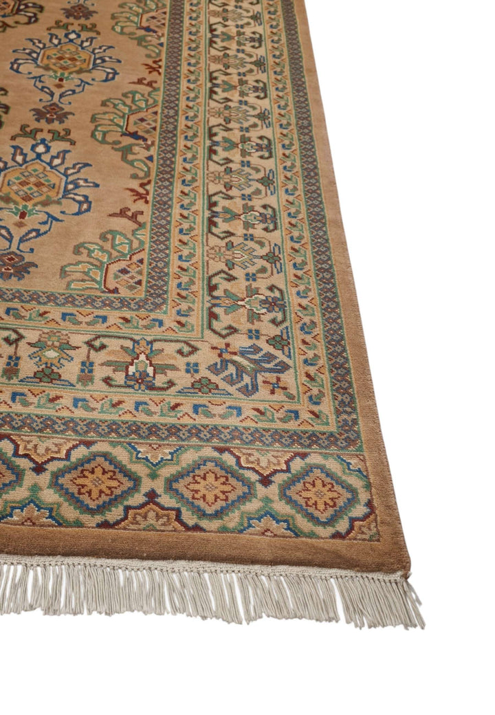 Hand-knotted apricot rug with silk palmette highlights