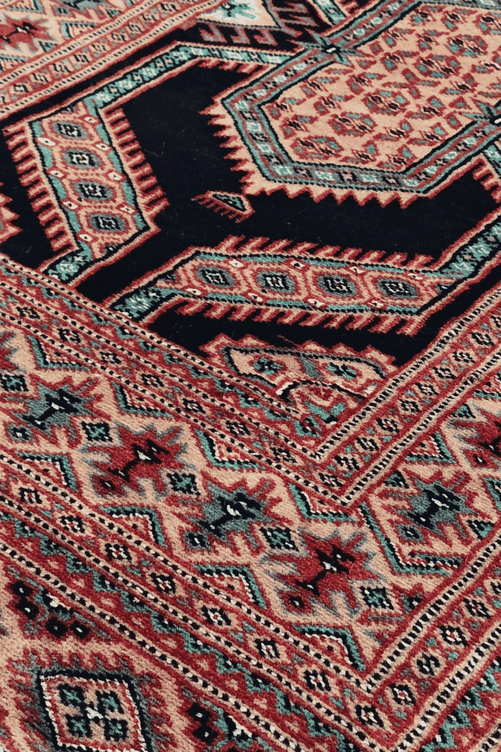 Nested medallion detail in indigo and camel on Jaldar runner