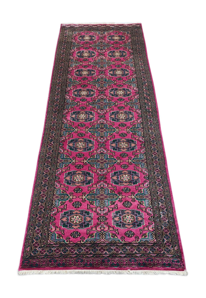 Border detail of magenta Jaldar hand-knotted Pakistani runner
