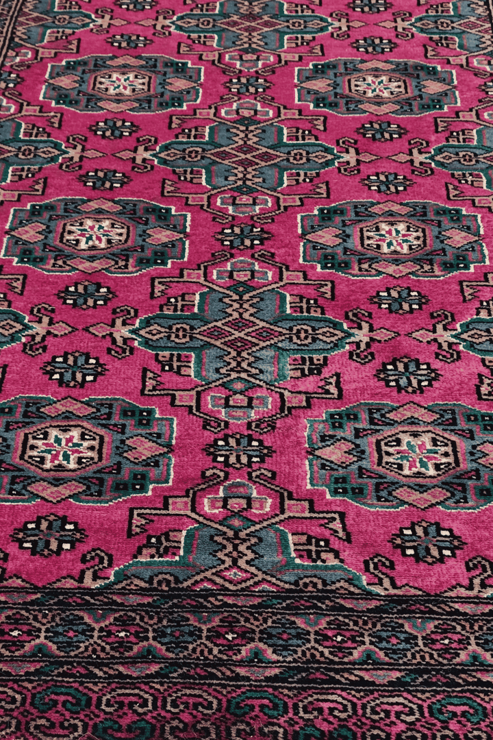 Hand-knotted magenta Jaldar runner with silk rosette güls