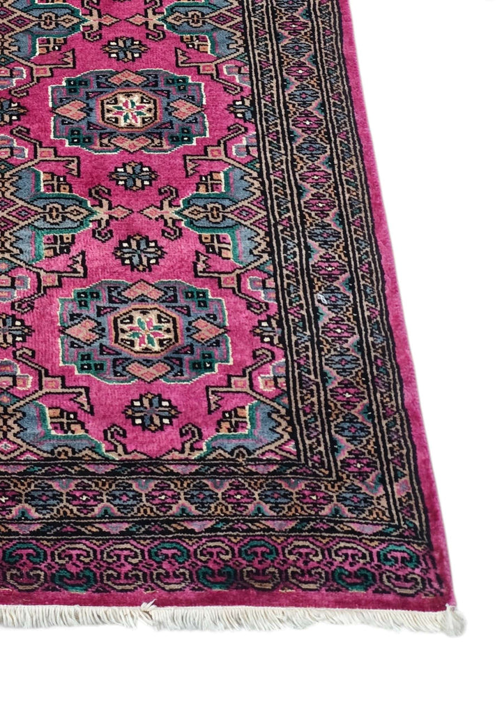 Corner of magenta and teal Jaldar hand-knotted runner