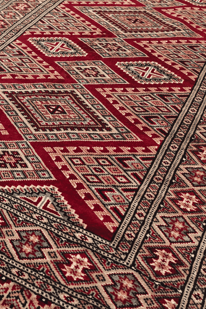 Lattice detail with Turkmen güls in wine and cream on Jaldar runner