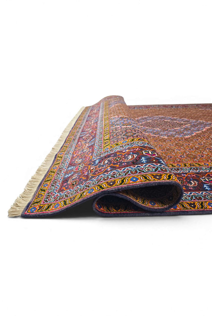 Corner of terracotta Ardabil hand-knotted rug