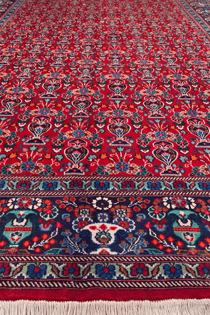 Fringe of cherry red Persian Moud rug