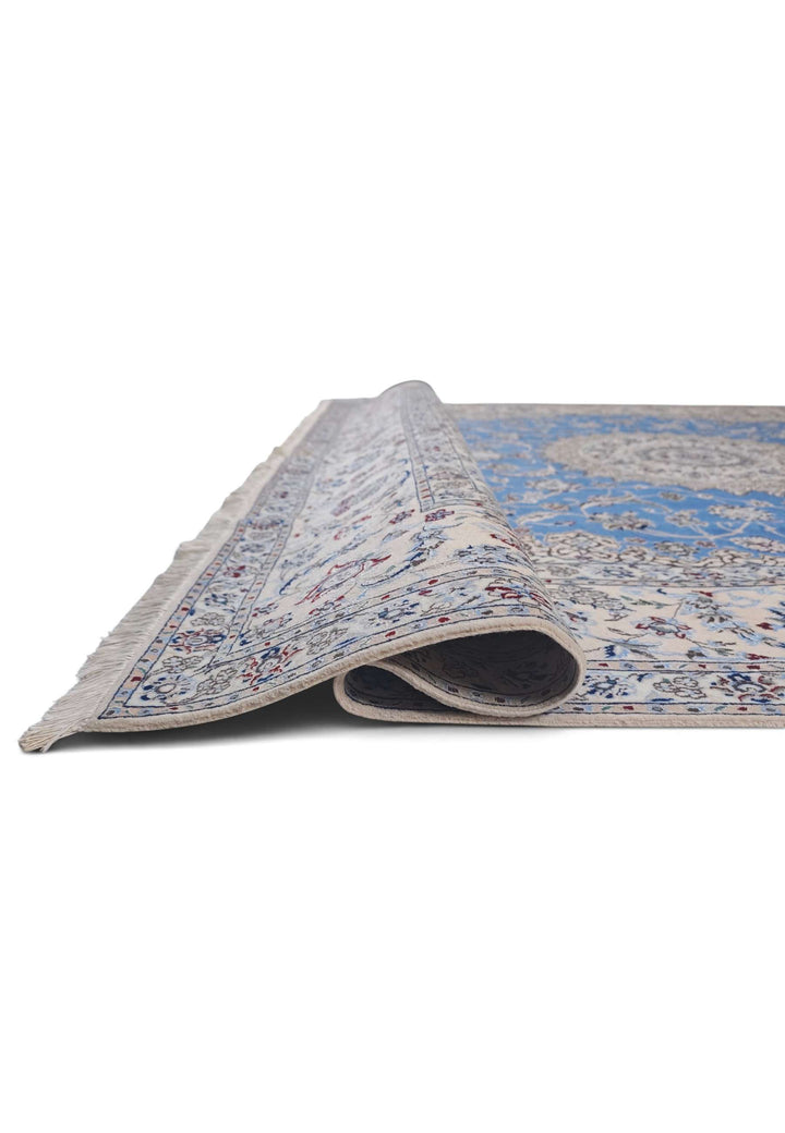 Fringe of blue and ivory Gonbad Persian Nain rug