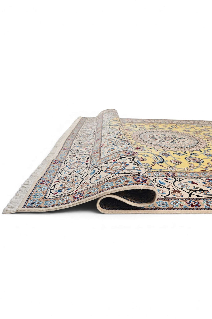 Corner of saffron yellow Nain hand-knotted rug