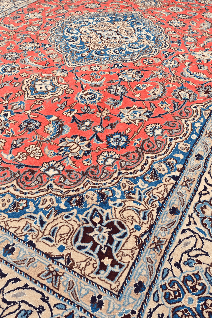 Border detail of coral Nain hand-knotted rug