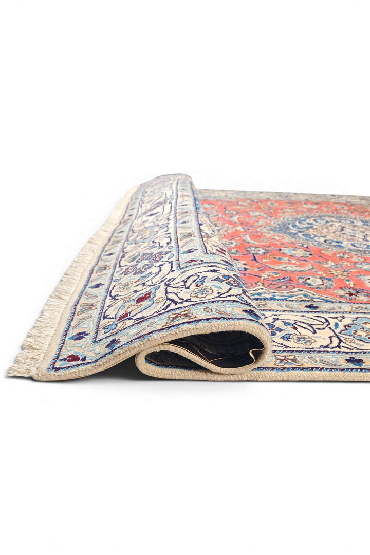 Corner of coral Nain hand-knotted rug