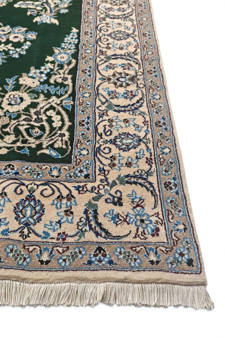 Fringe of forest green Persian Nain rug
