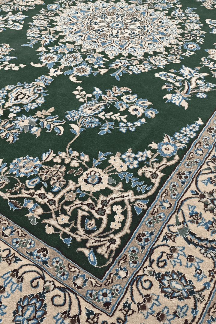 Border detail of forest green Nain hand-knotted rug