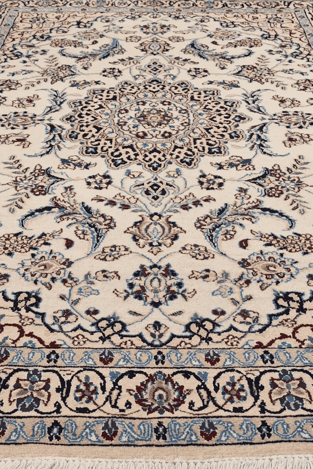 Corner of ivory Nain hand-knotted rug