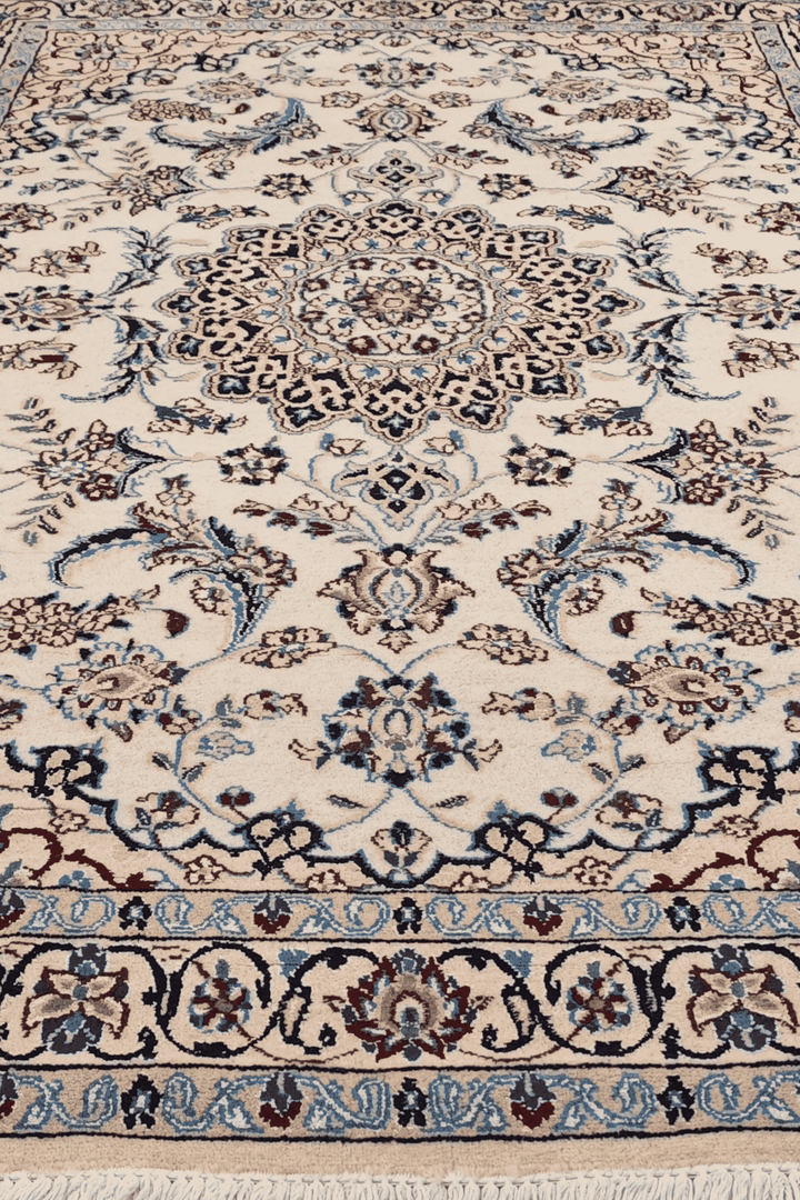 Corner of ivory Nain hand-knotted rug