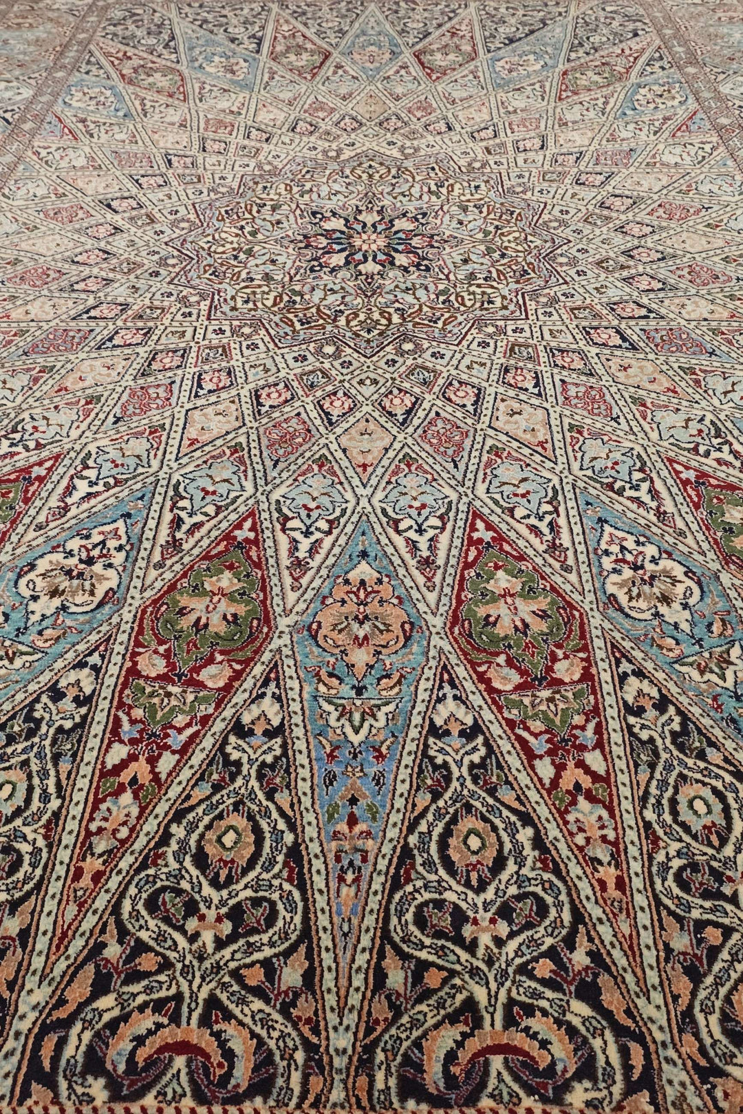 Corner of ivory blue Gonbad Nain rug